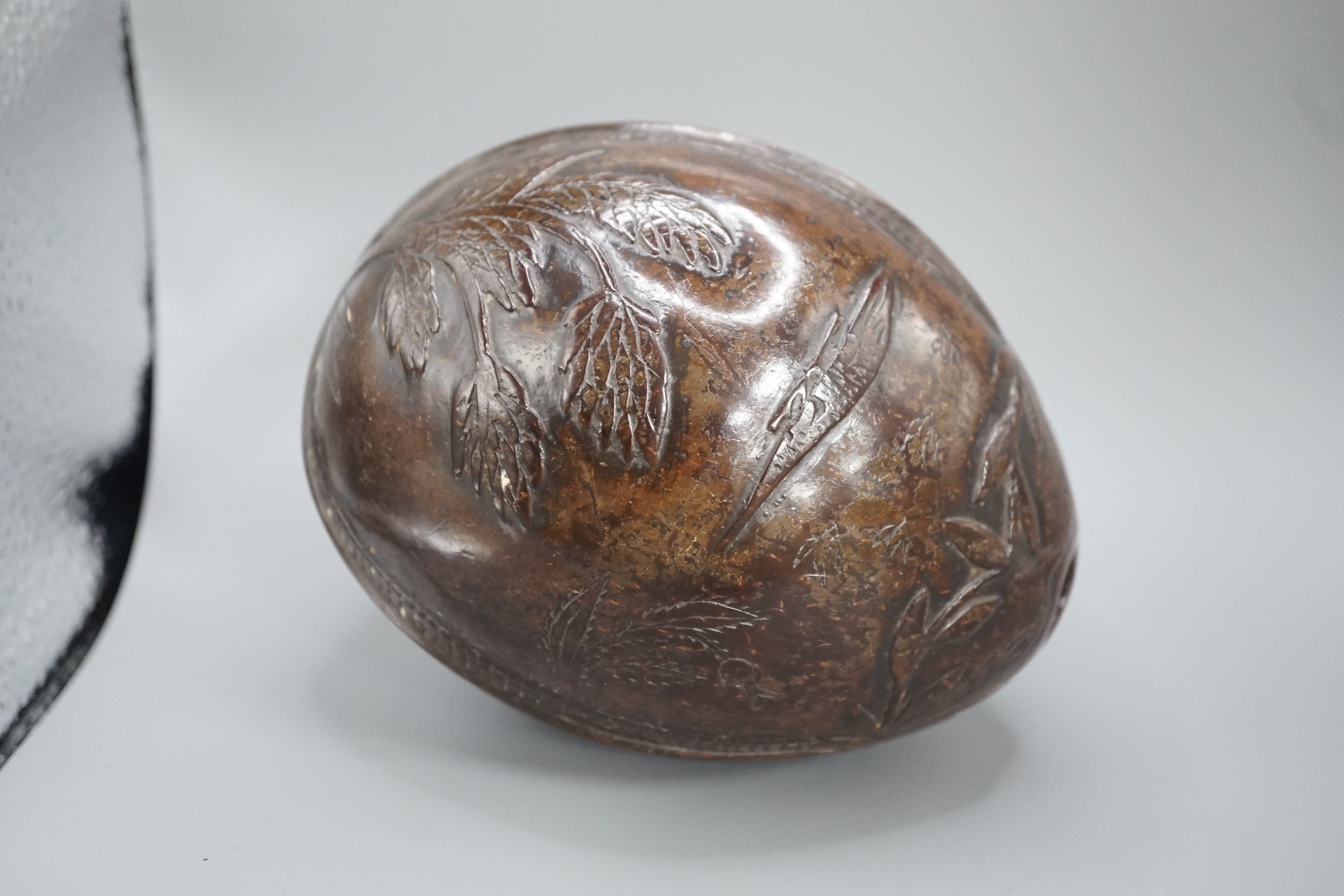 A 19th century carved coconut, 14 cm
